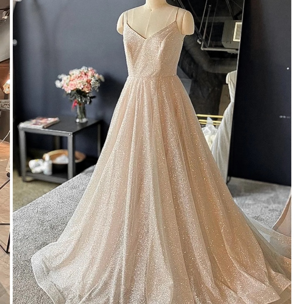 Olivia Botega. Size 14 wedding dress. Never warn and never altered.